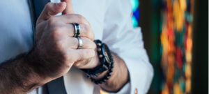 Why do guys wear two wedding rings